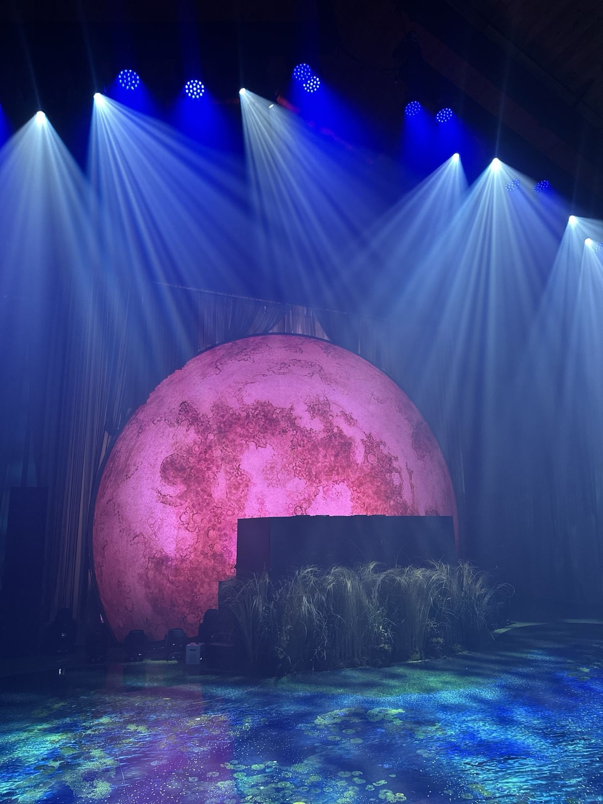 Stage with giant moon backdrop
