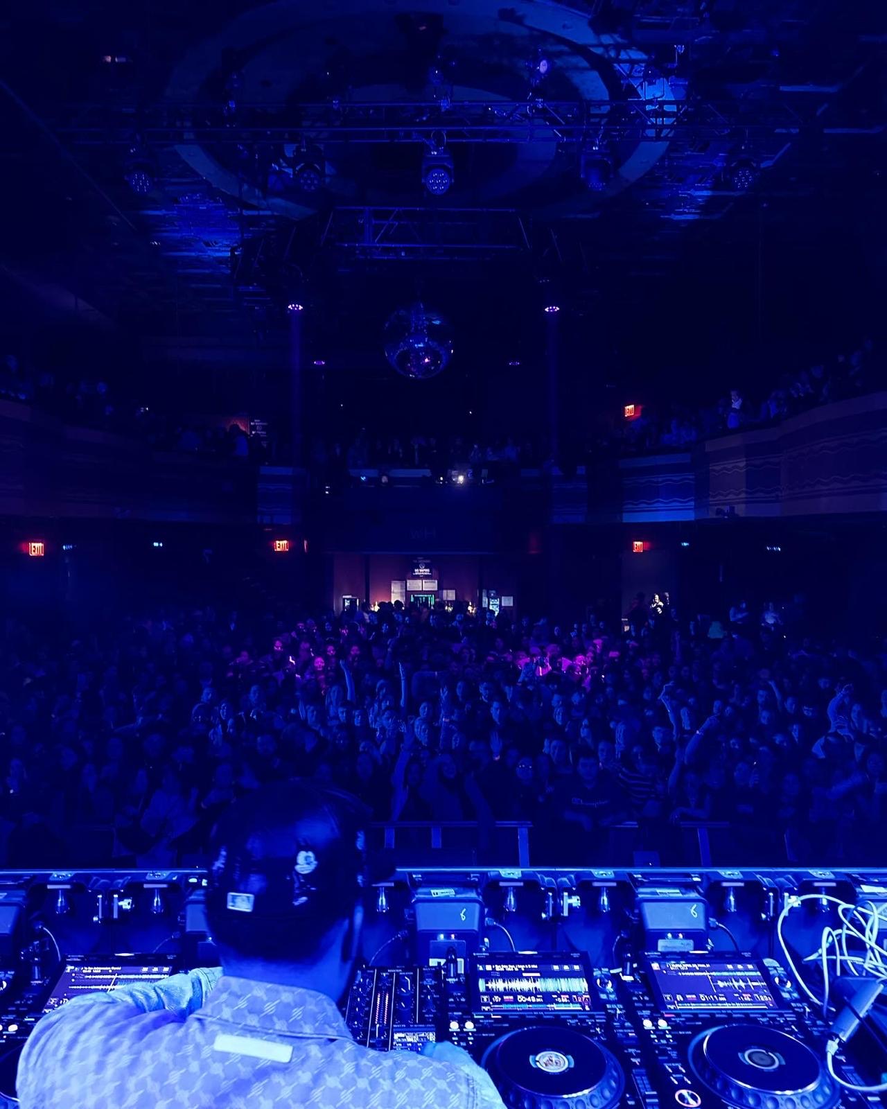 DJ performing for a packed crowd