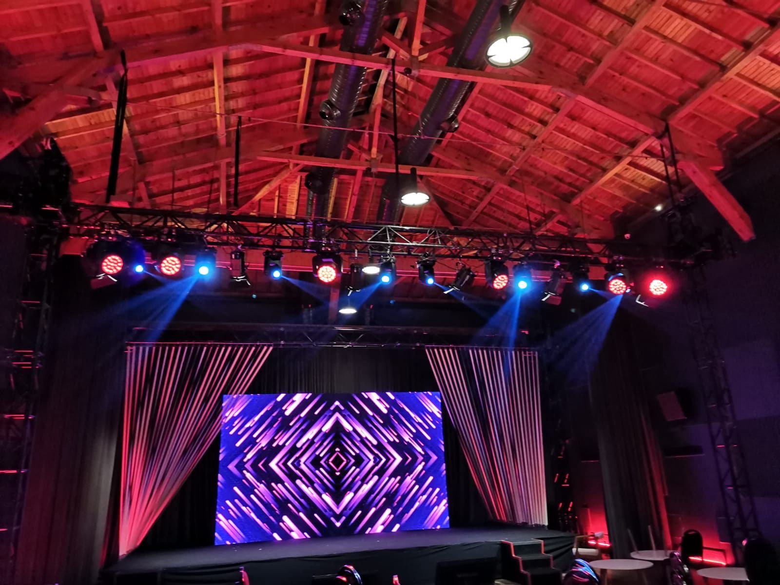 Venue with LED screen and red lighting