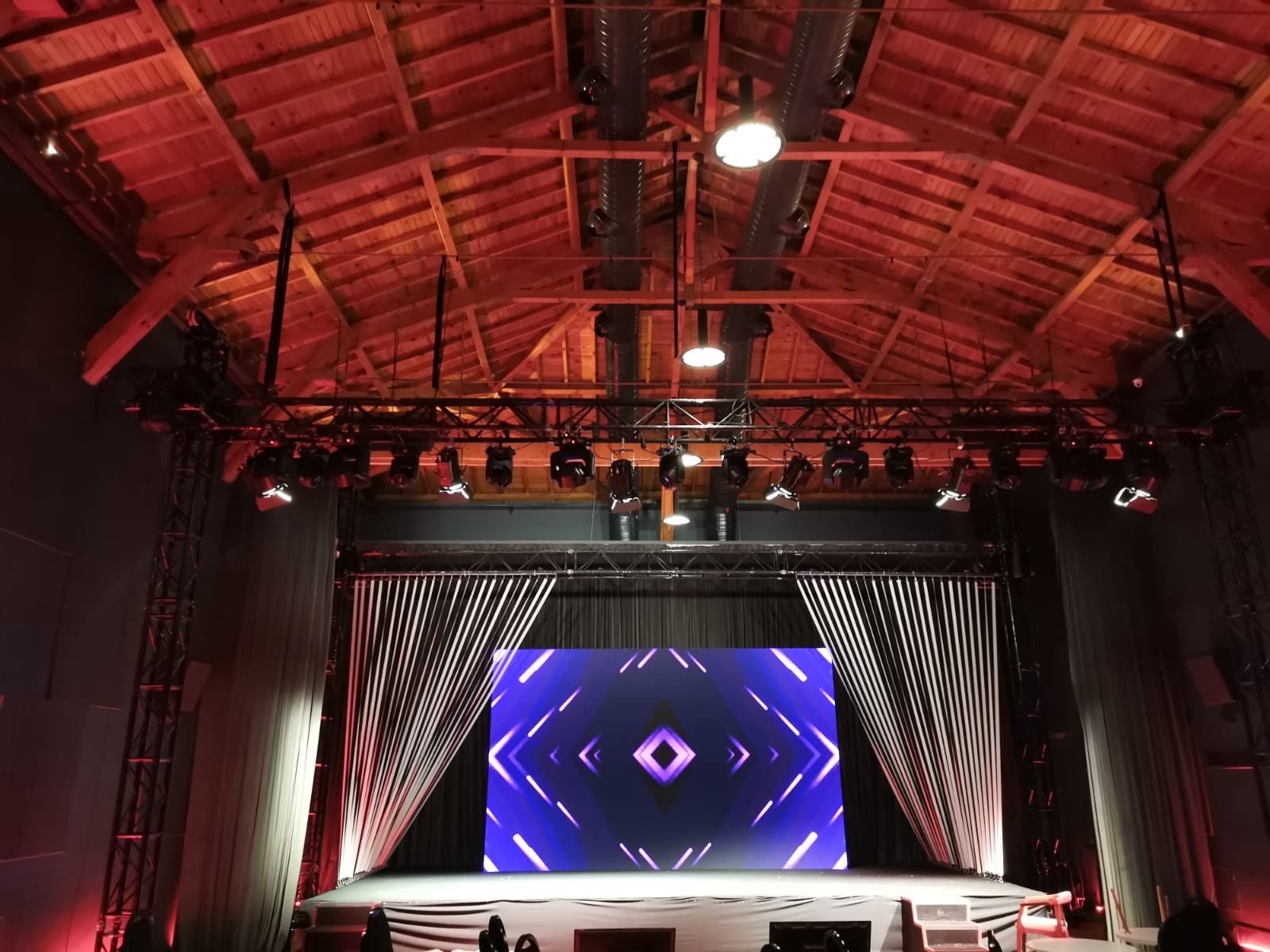 LED wall with geometric visuals in a venue